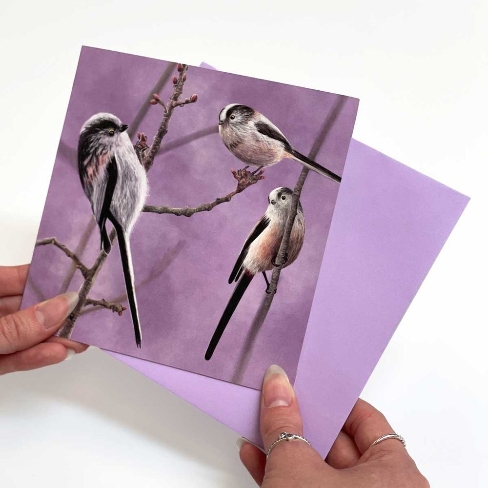 A finished long-tailed tits greeting card with a lilac envelope