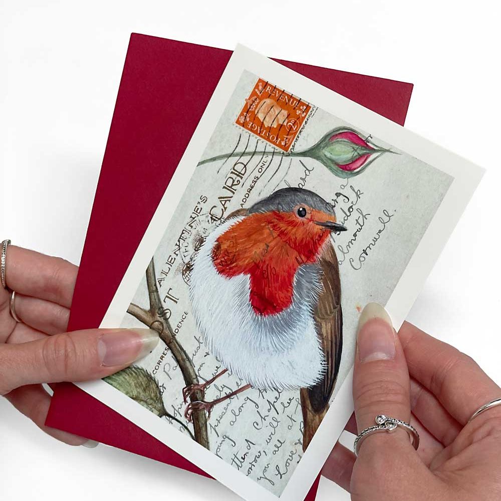 A portrait greeting card of a robin on a vintage postcard design, with a red envelope
